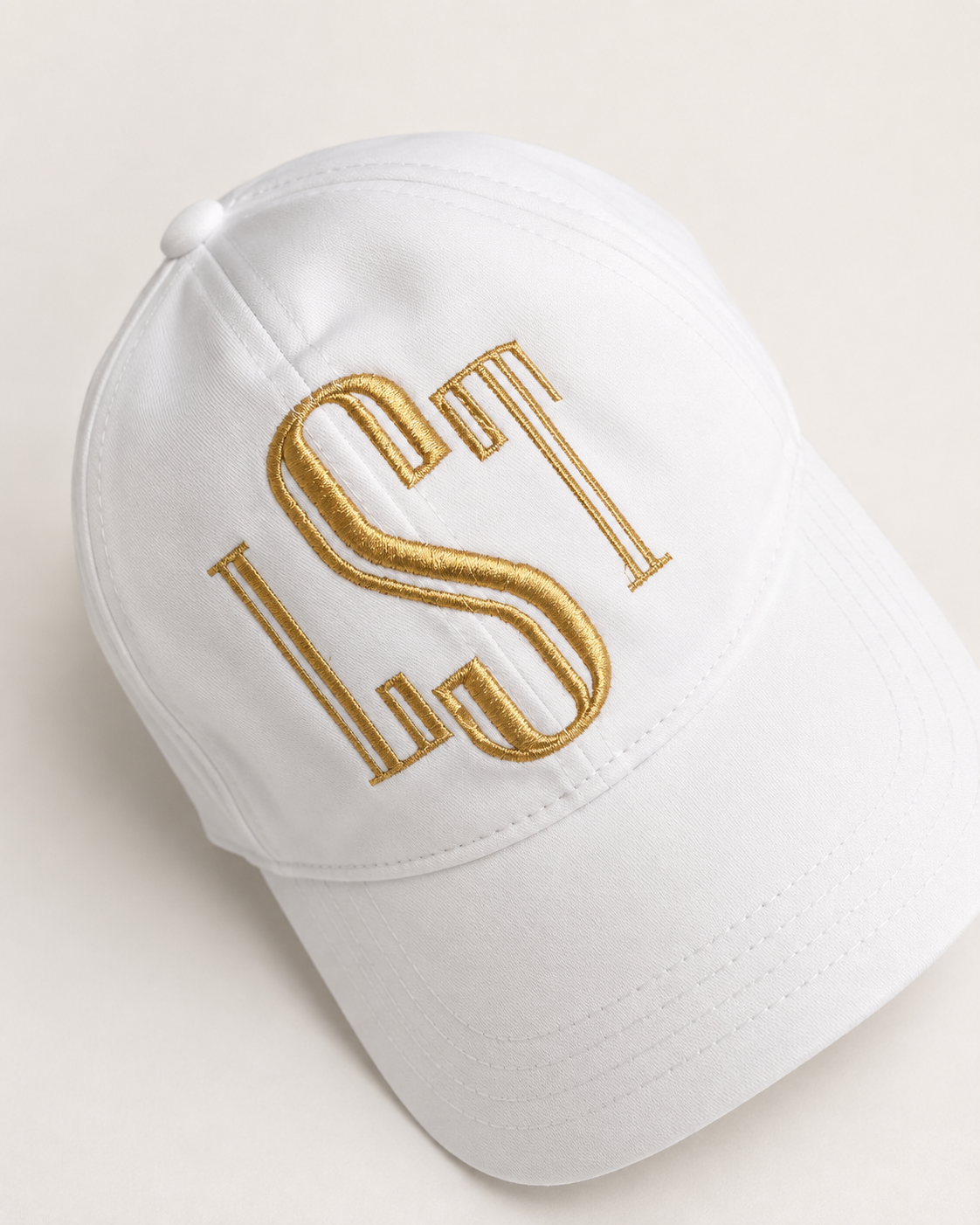 Gold monogrammed white baseball cap