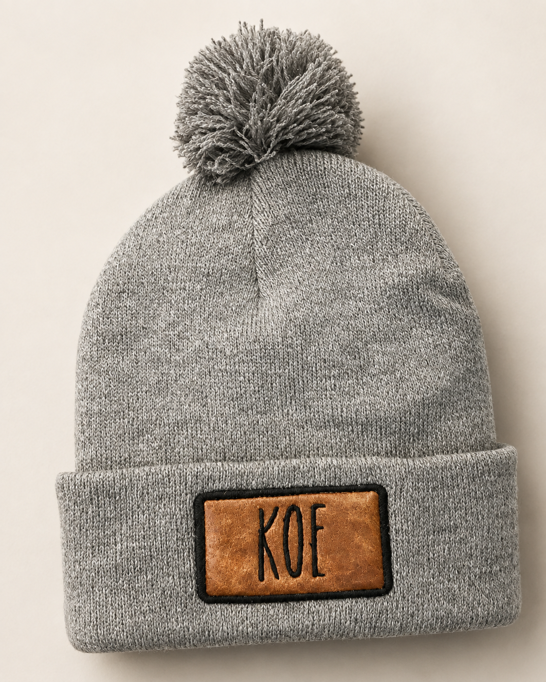 Gray knit beanie with personalized leather patch